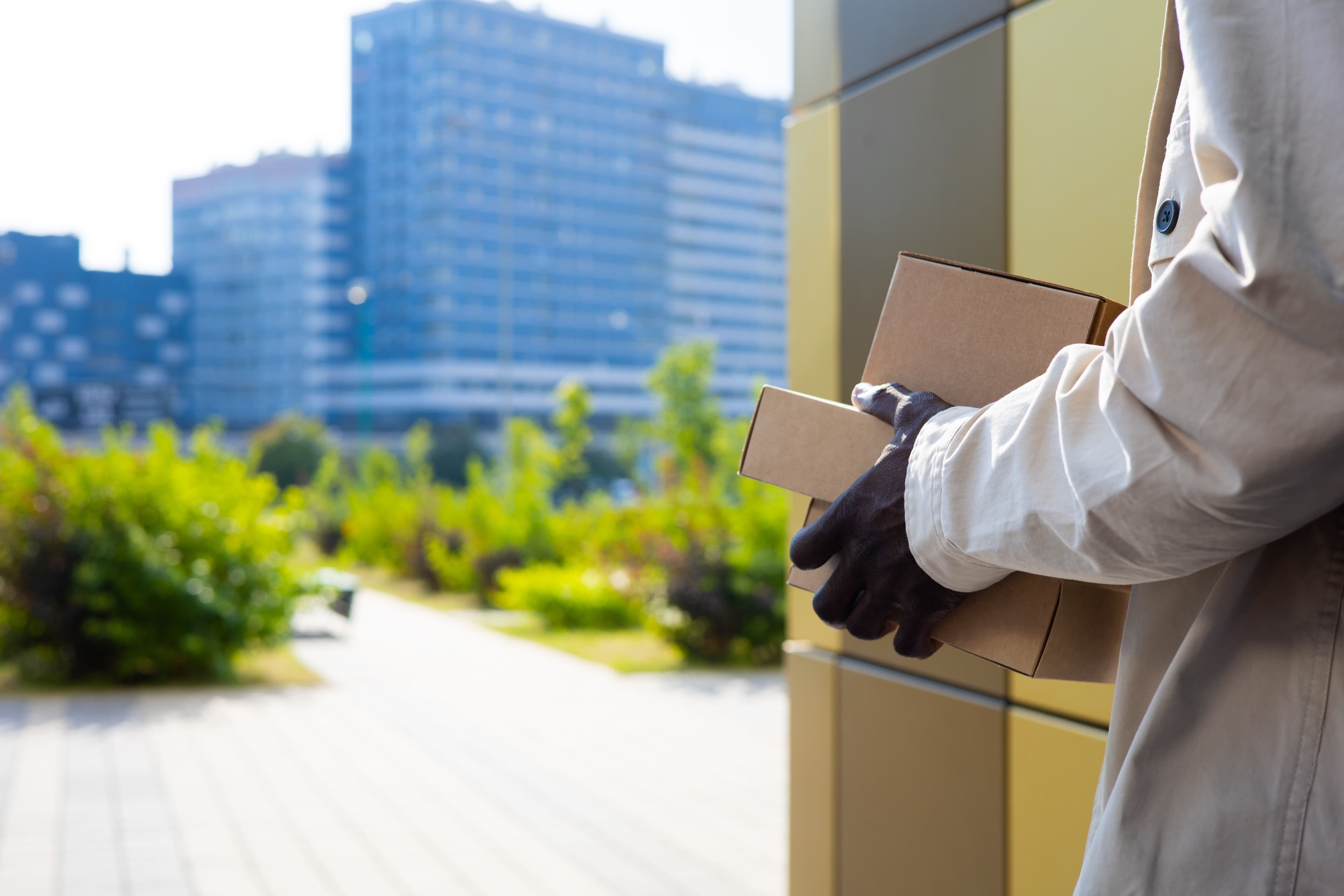 Courier carrying a package for a business delivery